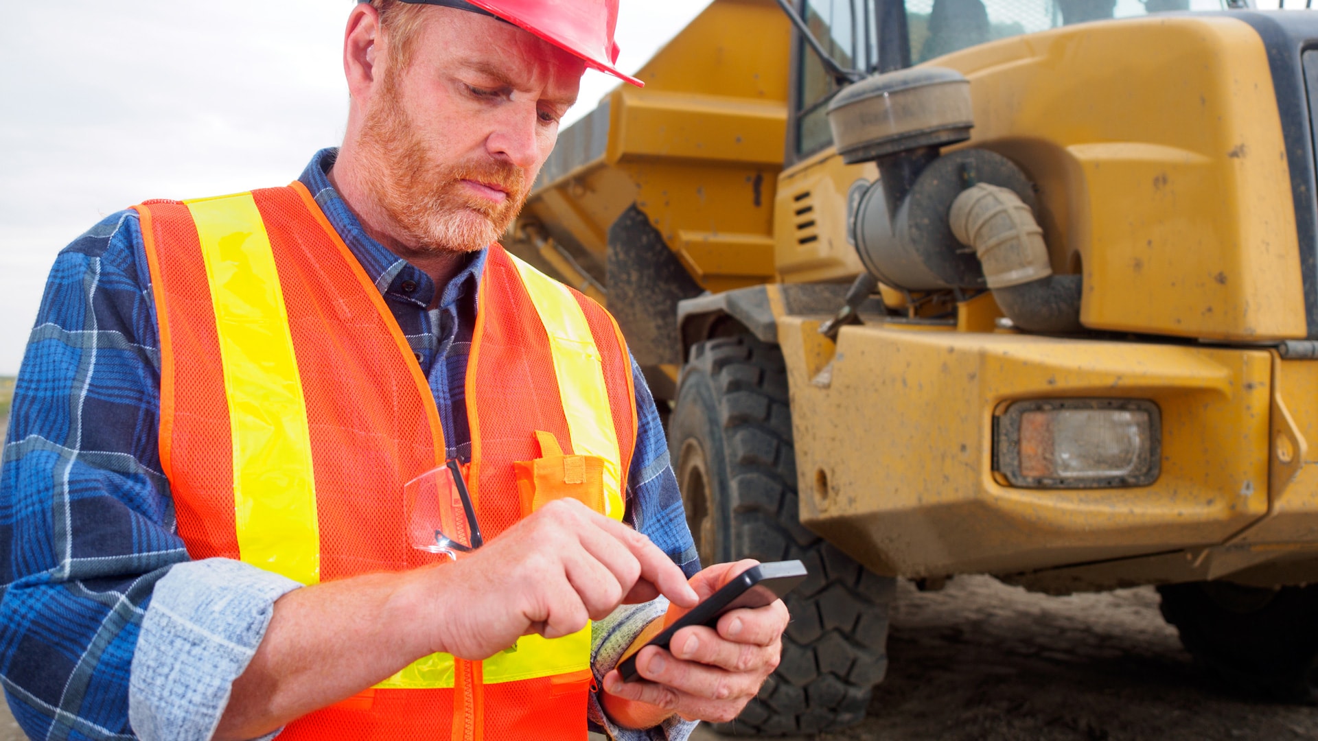 Employee using company smart phone with mobile device management in place