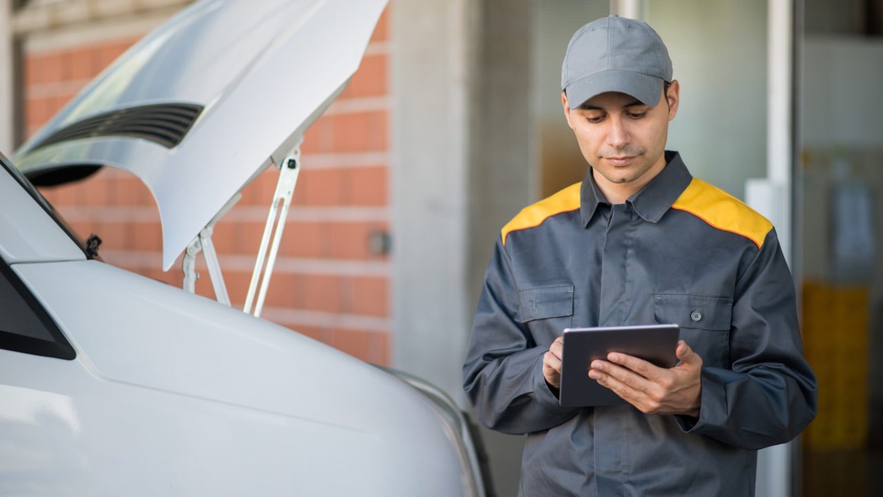 Employee using StreetEagle Mobile on tablet to access fleet maintenance software while in the field